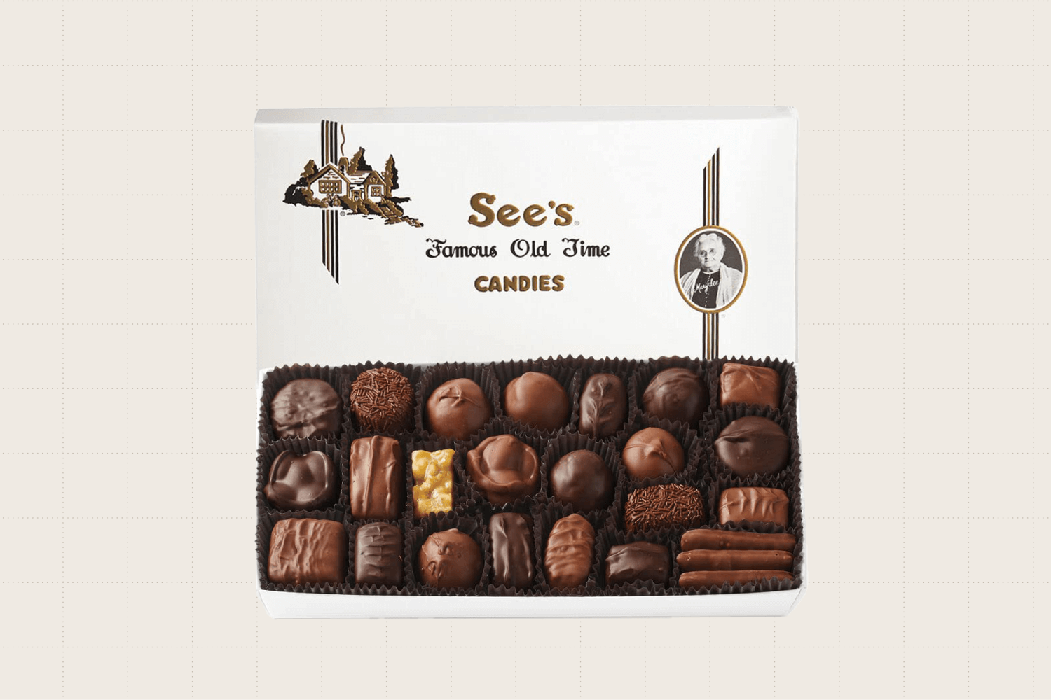 A 1-pound package of See's Candies Assorted Chocolates showing what the box looks like inside. There's a mix of milk and dark chocolate with a variety of fillings.