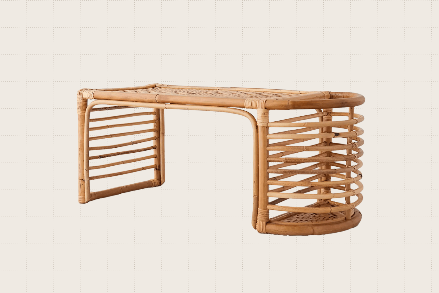 A rattan bed tray with a half-circle shaped pocket (also made of slatted rattan) on the right side for storing things like books or journals.