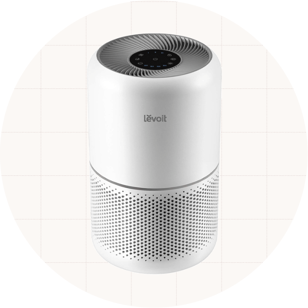 Photo of a LEVOIT air purifier against a beige background.