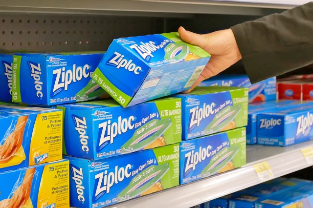 Anonymous person pulling a box of Ziploc sandwich bags off the shelf at a Walmart.