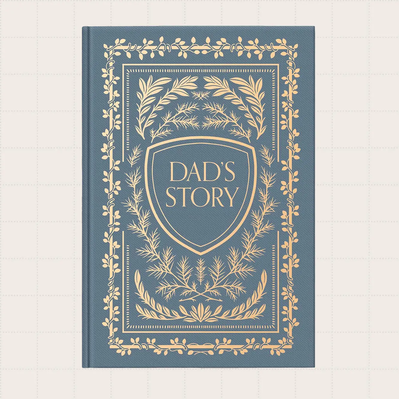 A dusty blue journal with a gold design on the cover that says "Dad's Story."